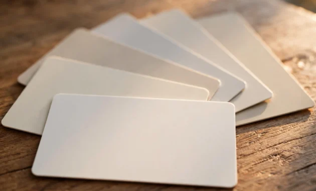 Several unsecured credit cards fanned out on a table
